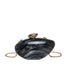 Oval shell acrylic evening bag in black with gold chain, perfect for evening occasions.
