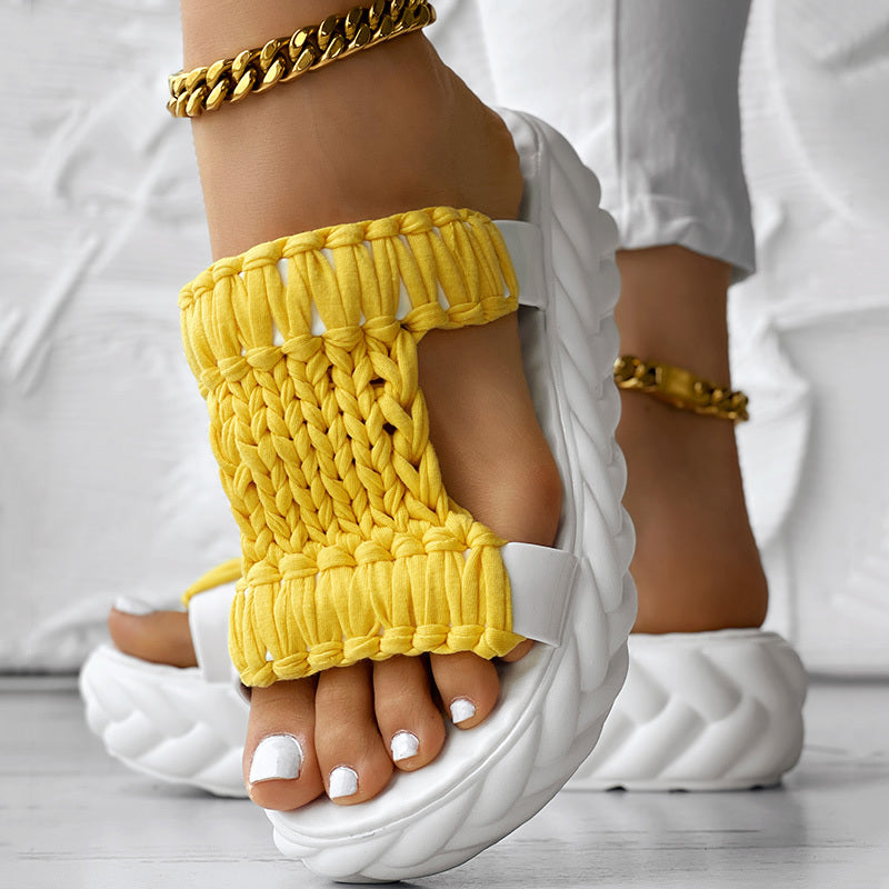 Braided open toe sandals with bright yellow knitted strap and thick white sole, perfect for summer wear.