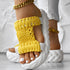 Braided open toe sandals with bright yellow knitted strap and thick white sole, perfect for summer wear.