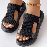 Braided knit platform sandals featuring a unique braided design and thick sole for comfort and style.