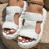 Platform sandals featuring a braided knit design, perfect summer footwear with a thick sole for comfort.