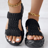 Braided knit platform sandals with black braided straps and thick sole, showcasing a unique style and comfort.