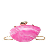 Oval shell acrylic evening bag in pink with gold closure and chain strap