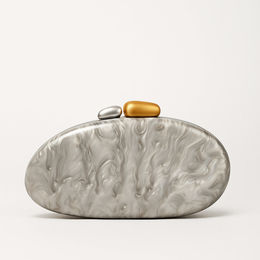New Fashion Special-shaped Dinner Clutch in silver with decorative stones in gold and silver.