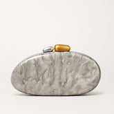 New Fashion Special-shaped Dinner Clutch in silver with decorative stones in gold and silver.