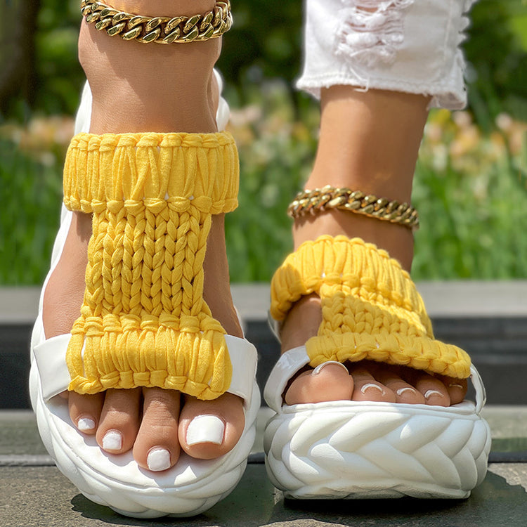 Braided open toe sandals with bright yellow knitted strap and thick white sole, ideal for summer fashion.