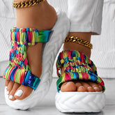 Braided summer sandals with a colorful rainbow stripe pattern and thick sole, ideal for breathable summer wear.