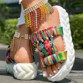 Colorful braided summer sandals with unique rainbow stripe pattern and thick sole for comfort.