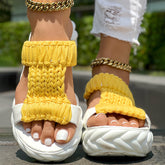 Braided open toe sandals with bright yellow knitted strap and thick white sole, ideal for summer wear.