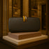 Clutch Bag Shape Crossbody Single Shoulder Dinner Bag displayed in a boutique setting on a pedestal.