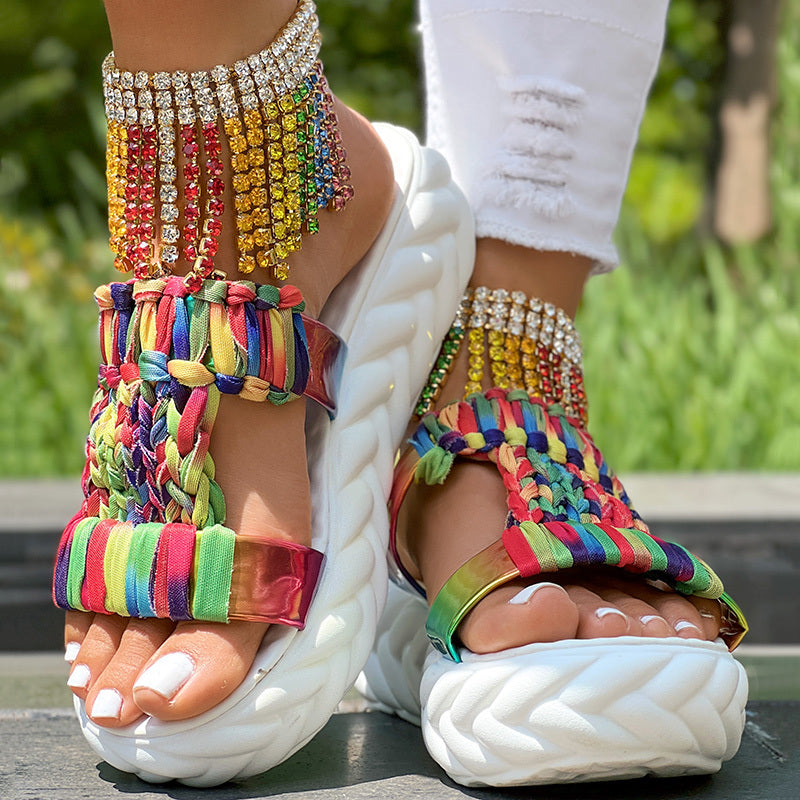 Colorful braided summer sandals with a thick sole and unique rainbow stripe pattern, perfect for summer fashion.